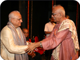 Being Received by Shri Basti Vamana Shenoy and Dr. C.S.Shenoy on the occasion of release of book –Kamaladevi Chattopadhya  on Behalf Vishva Konkani Parishad