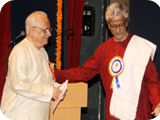 Being Received by Shri Basti Vamana Shenoy and Dr. C.S.Shenoy on the occasion of release of book –Kamaladevi Chattopadhya  on Behalf Vishva Konkani Parishad